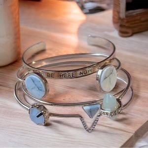 4 cute gold bracelets.